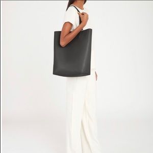 Cuyana tall structured black tote big purse